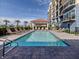 Community pool with a covered patio area at 507 Tamiami N Trl # 201, Venice, FL 34285