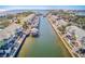 Wide aerial view of canal-front community with many boats at 5116 Beach Se Dr # D, St Petersburg, FL 33705