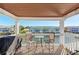 Waterfront balcony with table and chairs, offering scenic views at 5116 Beach Se Dr # D, St Petersburg, FL 33705