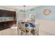 Kitchen dining area with table and six chairs at 5116 Beach Se Dr # D, St Petersburg, FL 33705