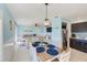 Bright dining area with seating for six, adjacent to living room and kitchen at 5116 Beach Se Dr # D, St Petersburg, FL 33705