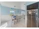 Bright dining area with table and chairs, near living room and kitchen at 5116 Beach Se Dr # D, St Petersburg, FL 33705