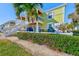 Two-story building with waterfront access and lush landscaping at 5116 Beach Se Dr # D, St Petersburg, FL 33705