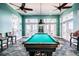 Game room with pool table and seating area at 5116 Beach Se Dr # D, St Petersburg, FL 33705