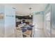 Bright kitchen with dark cabinetry and a dining area at 5116 Beach Se Dr # D, St Petersburg, FL 33705