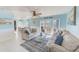 Open living area with comfortable seating and access to balcony at 5116 Beach Se Dr # D, St Petersburg, FL 33705