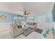 Spacious living room with comfy sofas and water views at 5116 Beach Se Dr # D, St Petersburg, FL 33705