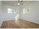 Bright bedroom with wood-look floors and ceiling fan at 5219 E 17Th Ave, Tampa, FL 33619