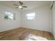 Bright bedroom featuring light wood floors and two windows at 5219 E 17Th Ave, Tampa, FL 33619