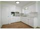 Newly renovated kitchen with white cabinets and quartz countertops at 5219 E 17Th Ave, Tampa, FL 33619