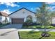 Bright white house with a brown door and garage at 5327 Kelper Hook Ct, Wimauma, FL 33598