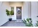 Inviting front entry with wreath and welcome mat at 5327 Kelper Hook Ct, Wimauma, FL 33598