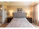 Main bedroom with tufted headboard and nightstands at 5548 Sentiero Dr, Nokomis, FL 34275