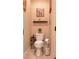 Convenient powder room with pedestal sink and decorative accents at 5548 Sentiero Dr, Nokomis, FL 34275