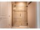 Large walk-in shower with glass enclosure and neutral tile at 5548 Sentiero Dr, Nokomis, FL 34275