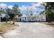 Updated single story home with a paved driveway and well-manicured landscaping at 6350 22Nd N Ave, St Petersburg, FL 33710