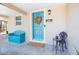 Inviting teal front door with a fall wreath and welcoming doormat at 6350 22Nd N Ave, St Petersburg, FL 33710
