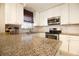 Renovated kitchen featuring granite countertops and stainless steel appliances at 6350 22Nd N Ave, St Petersburg, FL 33710