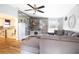 Spacious living room with a modern sectional sofa and wood-look floors at 6350 22Nd N Ave, St Petersburg, FL 33710