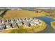 Aerial view of houses and green areas near a lake at 7815 Bronze Oak Dr, Wesley Chapel, FL 33545