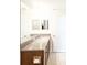 Bathroom with granite countertop, double sinks, and large mirror at 7815 Bronze Oak Dr, Wesley Chapel, FL 33545
