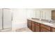 Elegant bathroom with granite countertops and double vanity at 7815 Bronze Oak Dr, Wesley Chapel, FL 33545