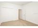 Bright bedroom with double door closet and carpet flooring at 7815 Bronze Oak Dr, Wesley Chapel, FL 33545