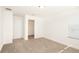 Bright bedroom with carpet flooring and a spacious closet at 7815 Bronze Oak Dr, Wesley Chapel, FL 33545