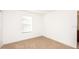 Simple bedroom with carpet flooring and window with blinds at 7815 Bronze Oak Dr, Wesley Chapel, FL 33545