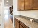 Additional kitchen counter space with granite countertop at 7815 Bronze Oak Dr, Wesley Chapel, FL 33545