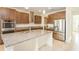 Modern kitchen with stainless steel appliances and granite countertops at 7815 Bronze Oak Dr, Wesley Chapel, FL 33545