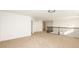 Loft overlooking main living area with carpet flooring and double doors at 7815 Bronze Oak Dr, Wesley Chapel, FL 33545