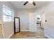 Light and airy bedroom with mirror, door to living area, and wood-look floors at 827 26Th S Ave, St Petersburg, FL 33705