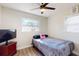 Bedroom with a bed, TV, and ceiling fan at 827 26Th S Ave, St Petersburg, FL 33705