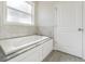 Relaxing bathroom with a soaking tub and granite countertop at 8510 Dee Cir, Riverview, FL 33569