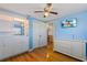 Bedroom with built-in shelving and hardwood floors at 8716 Hickorywood Ln, Tampa, FL 33615