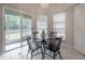 Charming breakfast nook with sliding glass doors leading to backyard at 9044 Westbay Blvd, Tampa, FL 33615