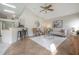 Open concept living room with hardwood floors and high ceilings at 9044 Westbay Blvd, Tampa, FL 33615