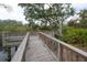 Wooden deck overlooking a tranquil waterway, perfect for enjoying the scenery at 9044 Westbay Blvd, Tampa, FL 33615