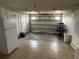 Spacious garage with overhead door, ample room for parking and storage, plus a refrigerator at 1002 N Pebble Beach Blvd # 1002, Sun City Center, FL 33573