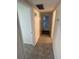 Clean hallway with tile flooring and access to bedrooms and bath at 1002 N Pebble Beach Blvd # 1002, Sun City Center, FL 33573