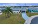 Single story home with driveway and grassy yard at 1205 Chevy Chase Dr, Sun City Center, FL 33573