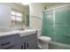 Clean bathroom with gray vanity and a large shower at 1205 Chevy Chase Dr, Sun City Center, FL 33573