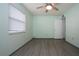 Light and airy bedroom with window blinds and vinyl flooring at 1205 Chevy Chase Dr, Sun City Center, FL 33573
