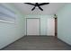 Bedroom with light green walls and double closets at 1205 Chevy Chase Dr, Sun City Center, FL 33573