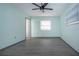 Bedroom with light green walls, wood-look flooring, and ceiling fan at 1205 Chevy Chase Dr, Sun City Center, FL 33573