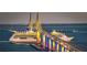 Cruise ships passing under a lighted bridge at night at 1205 Chevy Chase Dr, Sun City Center, FL 33573