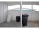 Covered exterior space with trash cans and storage area at 1205 Chevy Chase Dr, Sun City Center, FL 33573