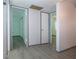 Hallway with light walls and wood-look flooring leading to bedrooms at 1205 Chevy Chase Dr, Sun City Center, FL 33573