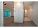Clean hallway with light walls and wood-look flooring at 1205 Chevy Chase Dr, Sun City Center, FL 33573
